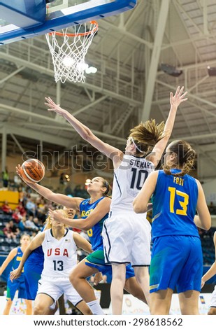 TORONTO,CANADA-JULY 16, 2015: Toronto 2015 Pan Am or Pan American Games, women basketball: Breanna Stewart defends the United States hoop against the attack of the Brazil team.CN 01953074