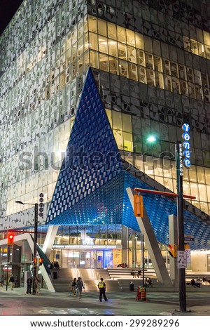 TORONTO,CANADA-JUNE 25,2015: Yonge street: New building of University of Toronto in downtown lighted and showing its modern architecture