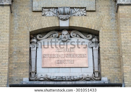 TORONTO,CANADA-JUNE 20,2015:Koeffler Student Services Centre: Plate with stucco and bas-reliefs on the wall of the building at the University of Toronto