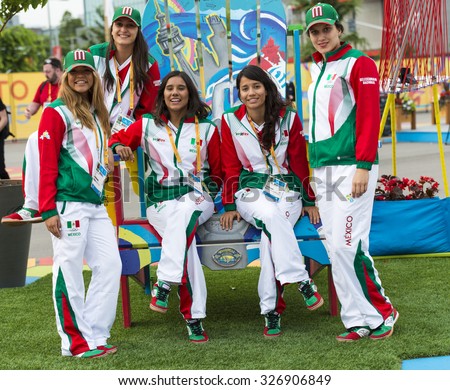 TORONTO,CANADA-JULY 8,2015: Women athletes from Mexico in joyful mood posing for photograph at the 2015 Pan Am Games, Toronto. Pan-Am Games were a major international multi-sport event