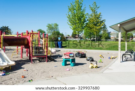 Toronto Images: Children's play area at a park. Canadian blessings: people throw toys in public areas for sharing instead of putting them in the garbage.