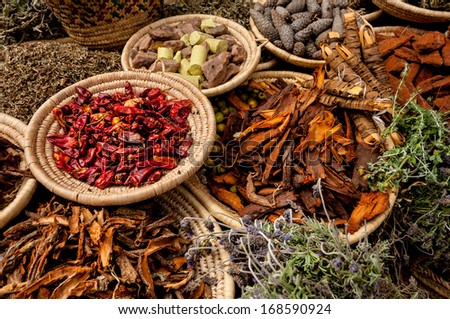 A selection of herbs and spices arranged in baskets outside a shop in Marakech, Morocco.