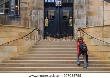 GLASGOW, SCOTLAND - MARCH 13, 2010: A student heading to the entrance of the Glasgow School of Art on March 13, 2010 in Glasgow.