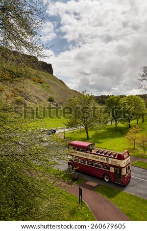 EDINBURGH SCOTLAND- MAY 12: a vintage double deck tour bus In the Holyrood Park on May 12, 2012 in Edinburgh, Scotland. Edinburgh is the UK\'s second most visited tourist destination after London.