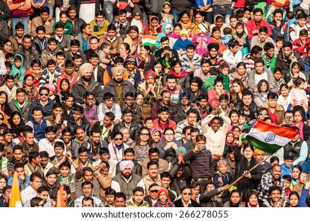 WAGAH, INDIA, JANUARY - 26, 2015: Crowd of Indian people celebrating at India-Pakistan Wagah border flag ceremony during the India Republic Day on January, 26 2015 in Wagah, India.