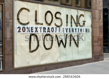 Closing down sign in a city centre shop.