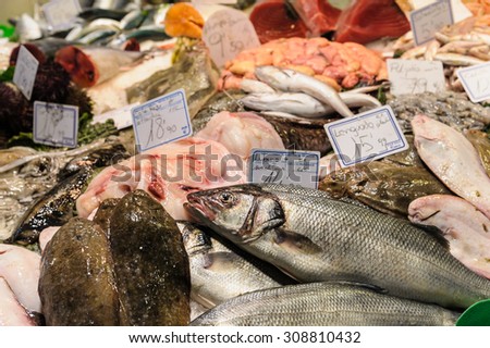 BARCELONA, SPAIN - MARCH 12, 2012: Fish and seafood on sale in Sant Josep de la Boqueria Market.  This market is one of the most visited tourist attractions in Barcelona.