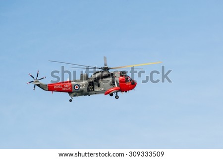 KILLIN, SCOTLAND - JULY 09, 2012: A Royal Navy search and rescue helicopter leaving refuelling station in Killin, Scotland.