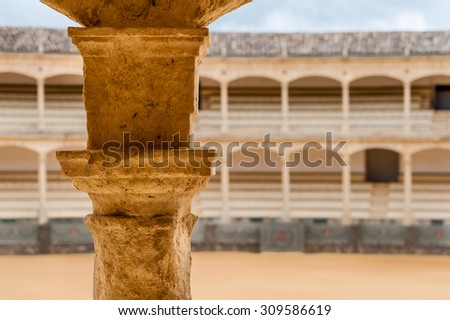 RONDA, SPAIN - MAY20, 2012: detail of stone pillar at the bullring at Ronda is the oldest bullfighting ring in Spain. It was built in 1784 in the Neoclassical style in 1784.