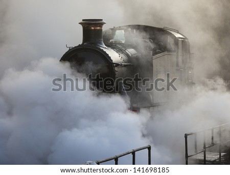 Restored steam locomotive steaming at Bewdley Station, Severn Valley Railway, Worcestershire, UK.