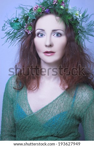 Romantic portrait of young charming woman with ginger hair.