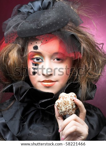 Young stylish lady in vintage hat with cakes