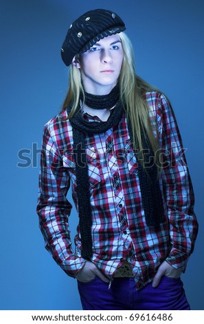 Street-kid. Young man with long hair in black scarf and kepi.