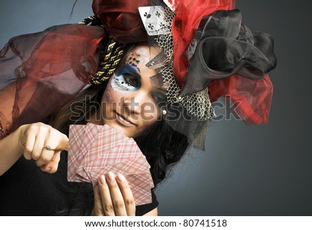 Queen of spade. Young lady in exotic hat with play-card\'s