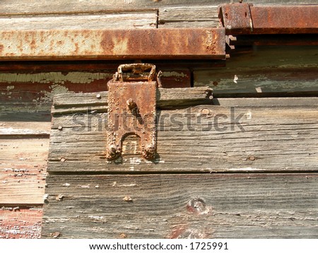 Rusted hinge on old shed