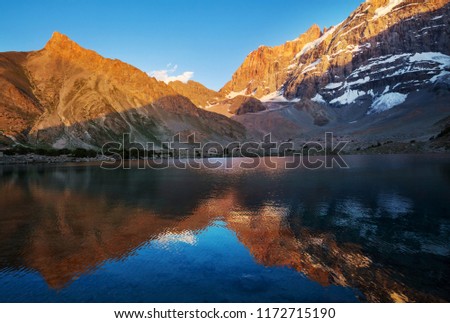 Similar – Image, Stock Photo Reflection of mountain and trees on lake in dolomite