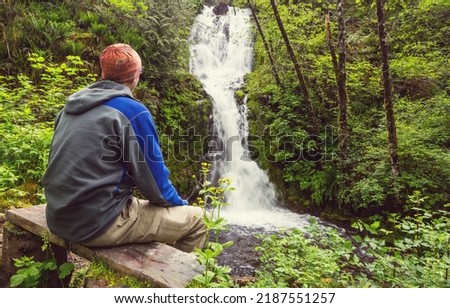 Similar – Image, Stock Photo A man in a hat looks friendly and a little bit melancholic into the camera