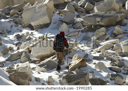 Climber in the stone on glacier
