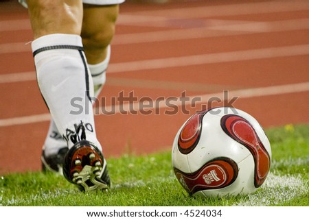 soccer corner-kick, focus on ball and legs