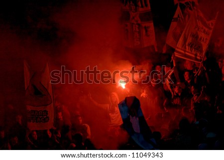 soccer fans with alight the torches at the stadium