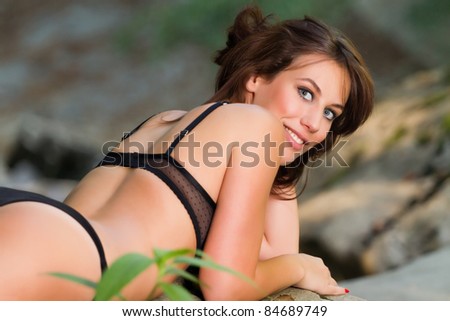 Portrait of beautiful brunette in bikini