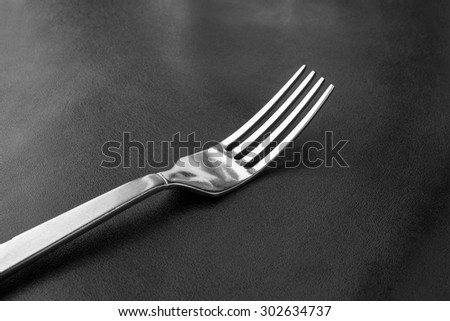 fork on table food , black and white
