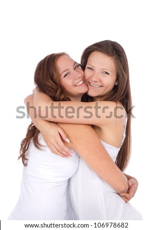 Two Teenage Girls Smiling And Hugging Over White Background Stock Photo ...