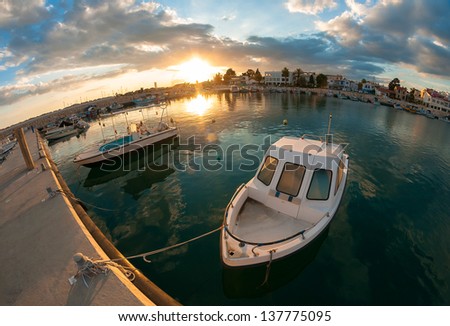 Small fishing boat at sunset. Cyprus