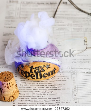 Releasing tax repellent on top of a 1040 income tax form