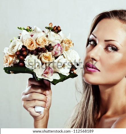 beautiful woman with flowers , glamour makeup , make-up , perfect clean skin , long hair