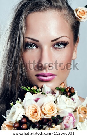 young beautiful woman with flowers , glamour makeup , make-up , perfect clean skin , long hair