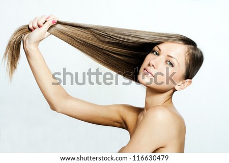 closeup portrait of a beautiful young woman with elegant long shiny hair