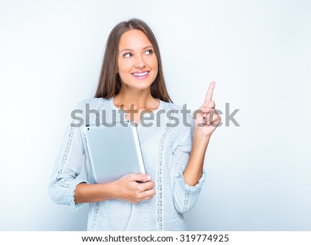 portrait of a smiling woman with tablet. isolated on white. beautiful girl using tablet computer.