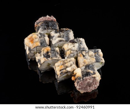 closeup of a  sushi roll , japanese food , on black background