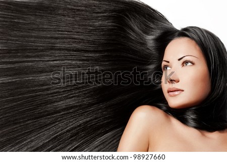 portrait of a beautiful young woman with healthy long brunette hair