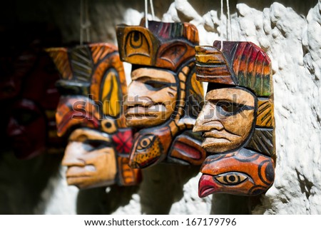 group of hand made masks for sale in a local shop in Belize