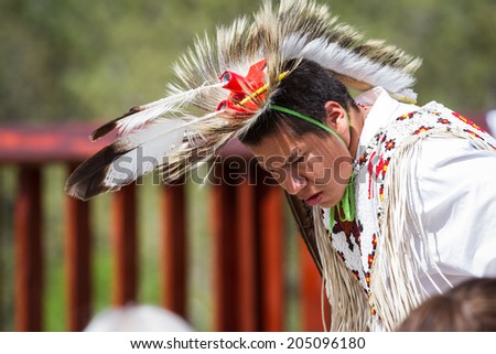Crazy Horse Memorial, South Dakota  - June 15 : Native American performing for a crowd in the Black HIlls, June 15 2014 in the Crazy Horse memorial, South Dakota
