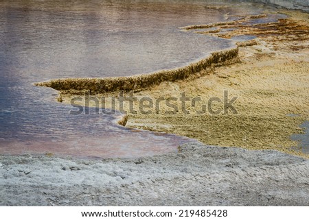 close up background of a mineral water flow leaving mineral deposits behind