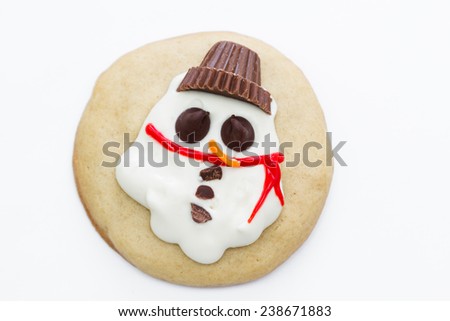 holiday cookies with a melted snowman for a fun seasonal concept on a white background