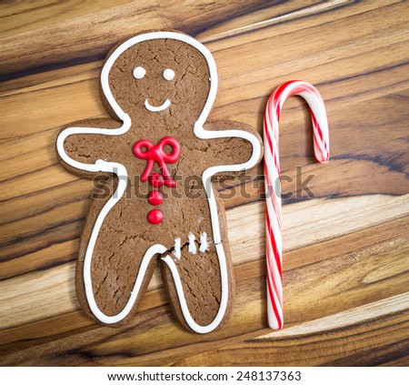 holiday classic, a gingerbread man with a candy cane for a walking cane