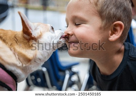 Similar – Child and dog in water