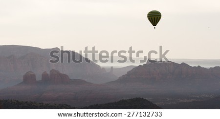 Smoke from a fire Over the valley in Sedona Arizona, view from a hot air ballon with another balloon in the frame