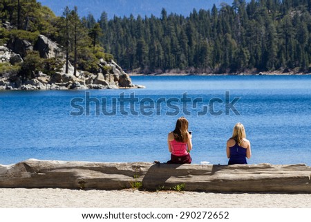 Lake Tahoe, California - April 29 : Two female friends enjoying a back after a long hike down to Emerald Bay, April 29 2015 Lake Tahoe, California.