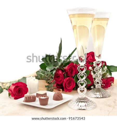 perfect valentines day surprise with chocolates, roses and champagne with hart stem glass