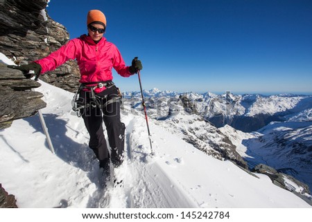 Young woman during winter mountain climb