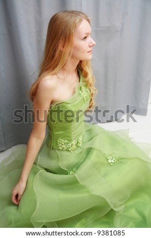 Beautiful young woman wearing prom dress
