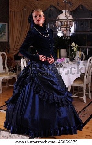Young woman posing in victorian dress