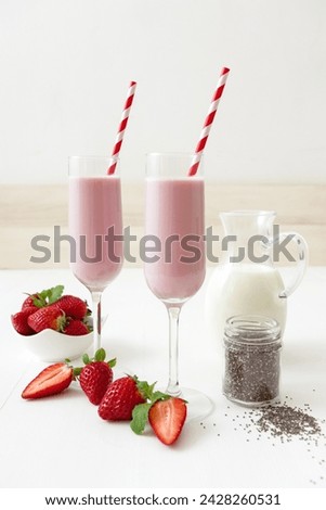 Similar – Image, Stock Photo Strawberry smoothie. Two glasses of berry slush. Summer cold drink