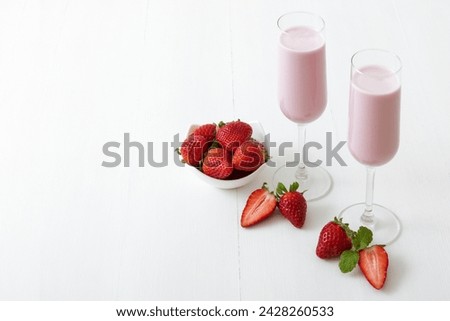 Similar – Image, Stock Photo Strawberry smoothie. Two glasses of berry slush. Summer cold drink