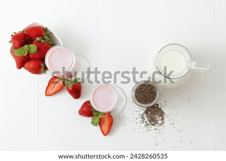 Similar – Image, Stock Photo Strawberry smoothie. Two glasses of berry slush. Summer cold drink